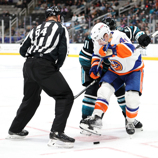 Jean-Gabriel Pageau (44) kicks the puck away from Luke Kunin (11) on a face-off