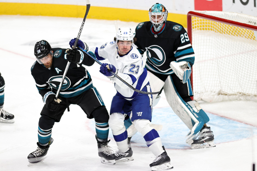 Lightning forward Michael Eyssimont (23) fights Sharks defenseman Mario Ferraro (38) for position in front of goalie Mackenzie Blackwood