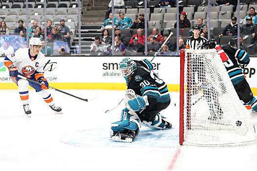 Noah Dobson's (not pictured) shot deflects past Sharks goalie Magnus Chrona for the Islanders first goal nineteen seconds into the game