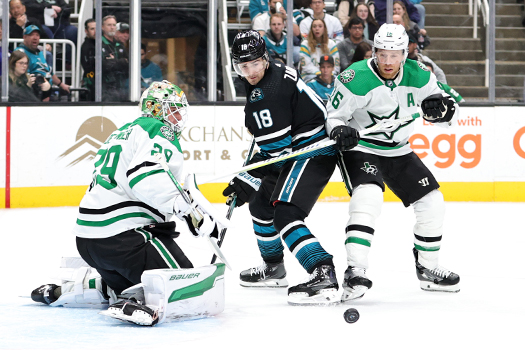 Stars goalie Jake Oettinger stops a shot as Filip Zadina (18) and Joe Paveiski (16) look for the rebound