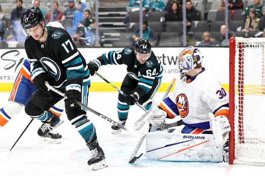 The puck deflects off Thomas Bordeleau's (17) skate past Islanders goalie Semyon Varlamov for the Sharks first goal