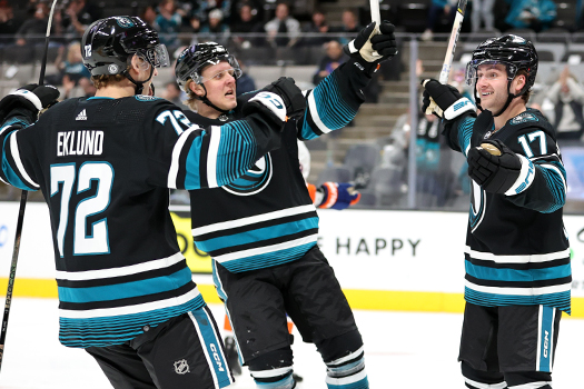 Thomas Bordeleau (17) celebrates his goal with teammates William Eklund (72) and Fabian Zetterlund (center)